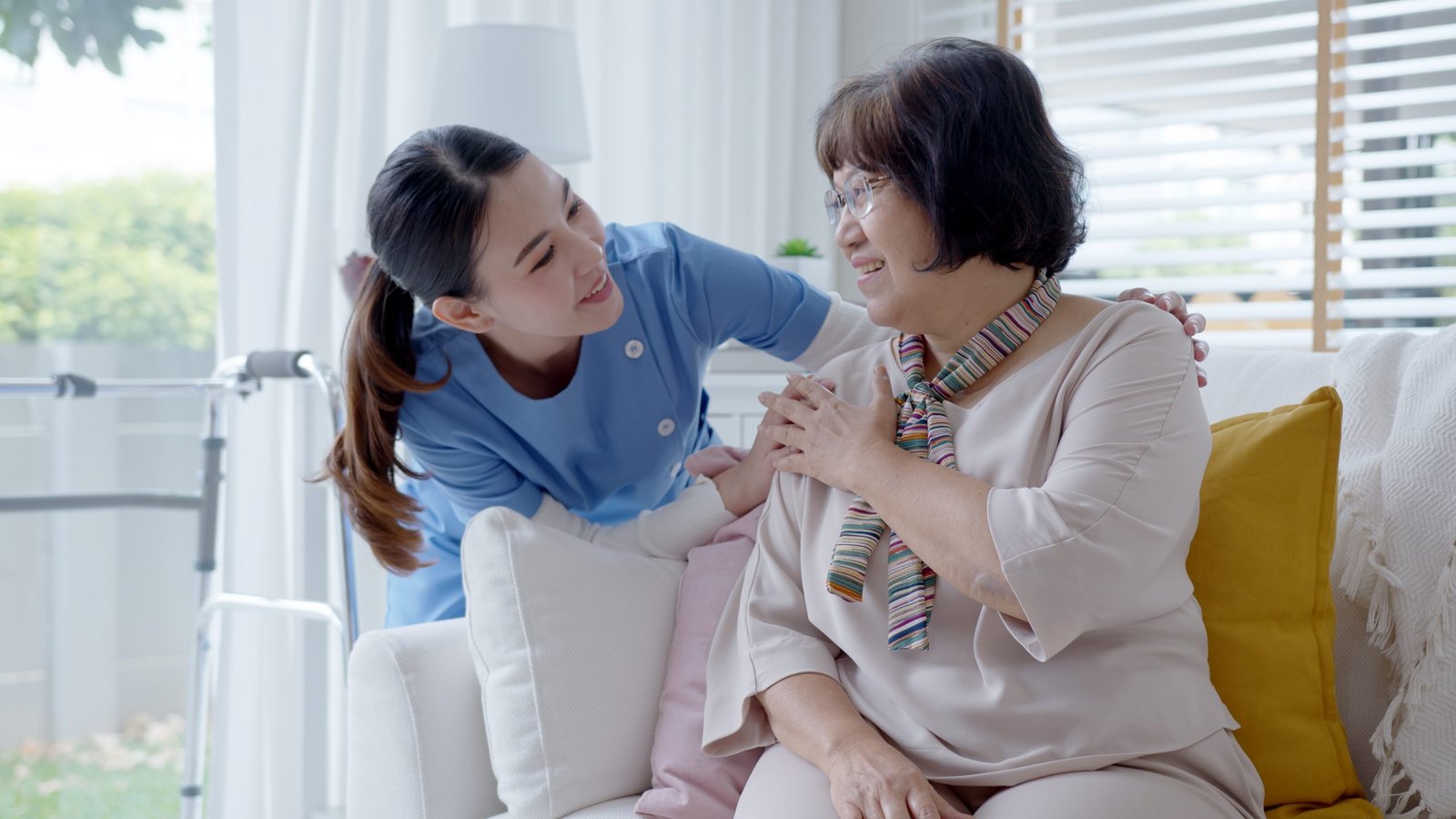 Young,Asian,Woman,Or,Nurse,Home,Care,Hand,On,Senior